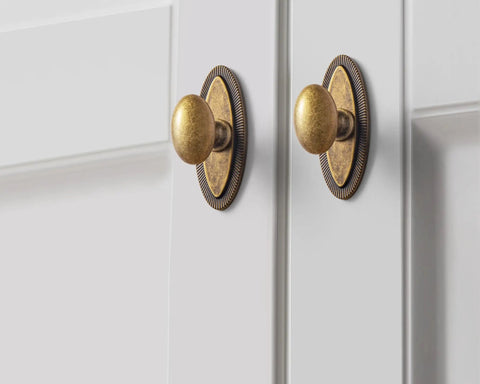 Badass Hella Smooth Antique Brass Cabinet Knobs With Oval Backplate For Kitchen Drawers And Furniture Upgrades Zinc Alloy Hardware close-up view.