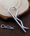 25 Piece Cotter Pin Set For Heavy Duty Use, Zinc Plated Hairpins Assortment With 5 Sizes M1.2x20mm, M1.5x30mm shown on wood