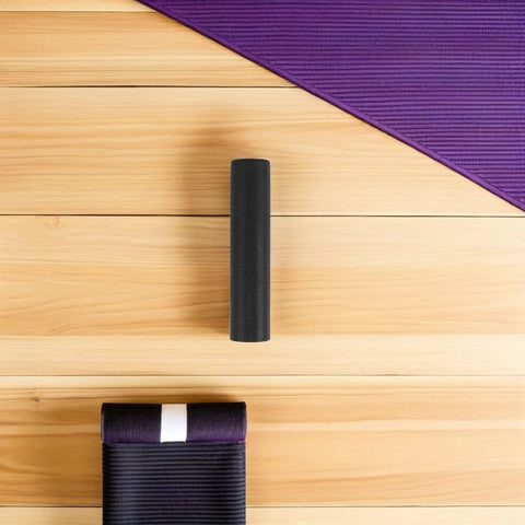 Ergonomic Lifting Handle Covers For Dumbbells And Barbells Non Slip Plastic Grips on wood floor with yoga mat
