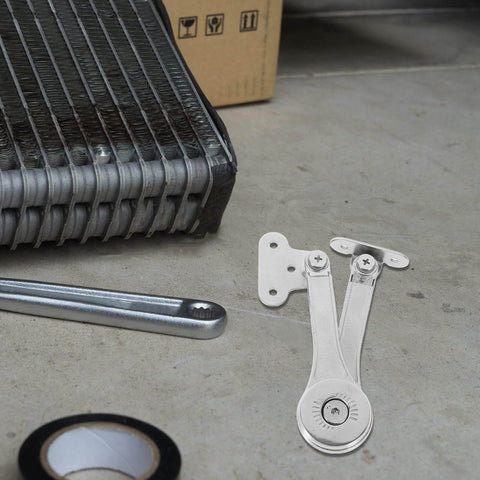 Heavy Duty Soft Close Lift Hinges For Cabinet Doors AGFELO 2 Pack Zinc Alloy placed on a workshop floor with tools nearby.