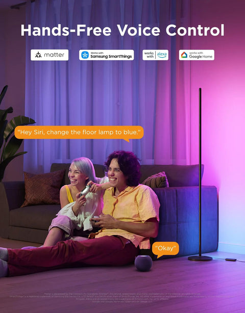 Govee RGBIC floor lamp, side view, purple ambient light beside sofa in living room.