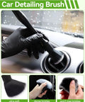 Car detailing brush with dense bristles used for cleaning air vent, shown in use by hand wearing black glove.
