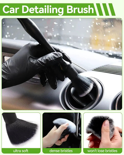 Car detailing brush with dense bristles used for cleaning air vent, shown in use by hand wearing black glove.