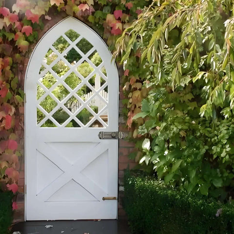 White garden gate with lattice design secured by Bronze Slide Door Bolt Gate Security Lock Latch With Mounting Screws for Sliding Doors and Windows Tough As Nails Zinc Alloy Construction Rust Resistant Antique Style Easy Mount 5 Inch Length.