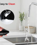 Powerful Milk Frother For Coffee And Lattes Fast Handheld Drink Mixer With Stainless Steel Whisk being cleaned under faucet