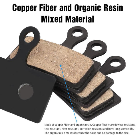 Four Pairs Bicycle Disc Brake Pads For Mountain Bike Riders showing copper fiber and organic resin layers