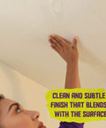 Person applying Fiberglass Drywall Repair Tape 6 Inch By 75 Foot Heavy Duty Self Adhesive Patch to a ceiling crack.