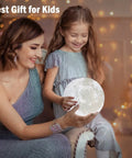 Mother and child with Lit 3D Moon Lamp 5.9 Inch With 16 Color Lights Remote And Touch Control Realistic Moon Surface, warm glow.