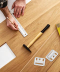 Heavy Duty Stainless Steel Wall Panel Clips 200 Pcs Hidden Backplate Fasteners on wooden surface with tools for installation.