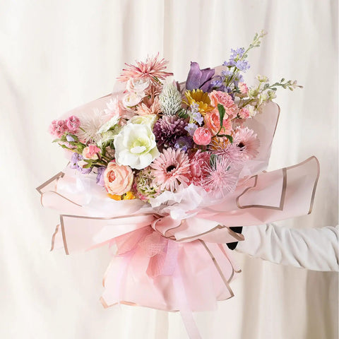 Bouquet wrapped in Pink Gold Edge Flower Wrapping Paper Set With 20 Sheets 22.8 By 22.8 Inches Waterproof Floral Wrap For Bouquets DIY