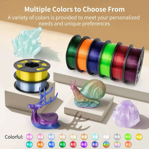 Multiple colored spools of filament and printed models displayed, showcasing Crystal Clear PETG Filament 1.75mm 1kg for 3D printing.