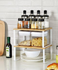 Stackable Cabinet Organizer Shelves Set Of 4 Hella Super Convenient Kitchen Pantry Storage, showing jars and pasta on a sleek countertop.