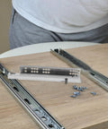 Hidden Two Part 10 Inch Slow Closing Drawer Slides with Detachable Silent Glides displayed on a wooden surface