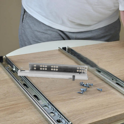 Hidden Two Part 10 Inch Slow Closing Drawer Slides with Detachable Silent Glides displayed on a wooden surface