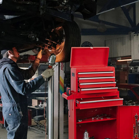 Auto mechanic working near Detachable 3 Drawer Tool Chest With Large Storage Cabinet And Adjustable Shelf Heavy Duty Red Black Rollin Garage Workshop Organizer For Tools Hardware And Gear in garage.