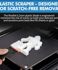 Plastic scraper in Dual Tool 3D Printer Scraper Set removing 3D print safely from PEI bed without scratches