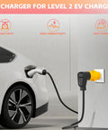 Nema 6-50P To 14-50R EV Level 2 Charging Adapter connected to a Tesla for charging with heavy duty plug.