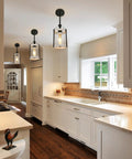 Farmhouse Pendant Light With Seeded Glass And Metal Cage, Rustic Wood Finish Island Lighting Fixture for kitchen shown over island.