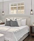Modern Farmhouse Pendant Light For Kitchen Island In Bronze Finish With Seeded Glass Shade illuminating bedroom.