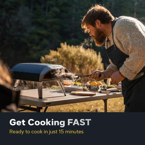 Man using Koda 12 Inch Gas Pizza Oven For Outdoor Cooking with 28 Millibar Regulator and Gas Hose Portable Oven on a patio table.