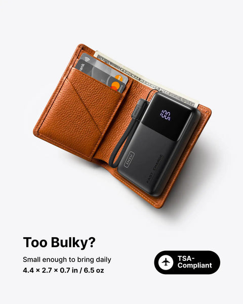 Throw This Compact 10000 Mah Power Bank In Your Pocket For Immediate Relief Packs 45W Usb C Pd Fast Charge For Phones Consoles And Laptops in a brown wallet.