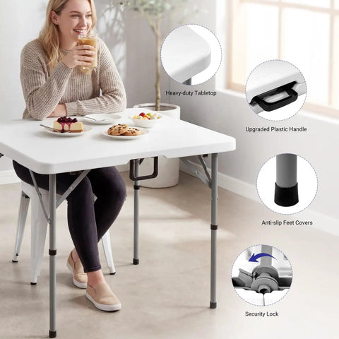 Woman sitting at 34 Inch Folding Square Card Table Portable Heavy Duty HDPE Fold In Half With Carrying Handle For Indoor Outdoor Use Party Ready Picnics Camping White Anytime.