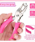 Hand holding Dual Size Circle Hole Punch With One Quarter Inch And One Eighth Inch Holes For Paper Crafts And Scrapbooking, pink grip