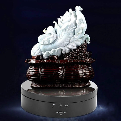 Aqur2020 Electric Rotating Display Stand For Jewelry With Three Speeds And Four Angle Settings showcasing ornate sculpture on a sleek black base.