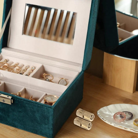 Open jewelry box with Eight Piece Golden Brass Invisible Barrel Hinges For Wooden Boxes And Cabinets nearby on table