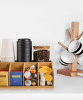 Bamboo Coffee Station Organizer with clear tray, five compartments displaying cups, tea bags, pods, and condiments for home use.