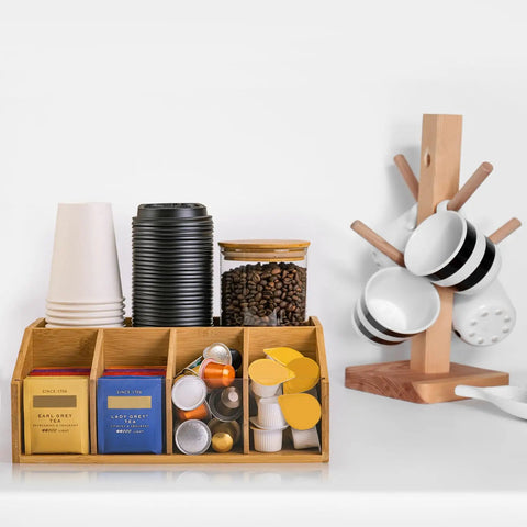 Bamboo Coffee Station Organizer with clear tray, five compartments displaying cups, tea bags, pods, and condiments for home use.