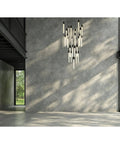 Modern 25 Light Crystal Pendant Ceiling Fixture With Matte Black Metal Frame And Contemporary Design For Indoor Living Spaces That Brings Straight Fire Vibes And Premium Swag hanging in a bright room.