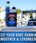 Marine Fuel System Treatment 32 Oz For Boats And Watercraft, Fuel System Cleaner And Injector Cleaner That Removes Water, Gum, And Varnish, Prevents Corrosion And Ethanol Damage, Treats Up To 320 Gallons, Improves Performance bottle with marina background.