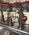 Universal Kitchen Sink Spray Attachment Pull Out Faucet Sprayer Head Brushed Nickel Finish on kitchen sink with decorative backdrop.