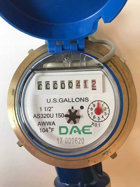 Close-up view of the 1-1/2 Inch Water Meter With Pulse Output For Gallon Measurement Inline Horizontal Flow Meter Kit face with couplings