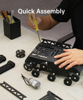 Person assembling Beefy All Metal Tank Chassis With DC Geared Motor And Shock Absorbing Suspension For A Full Track Robotic Moving Platform