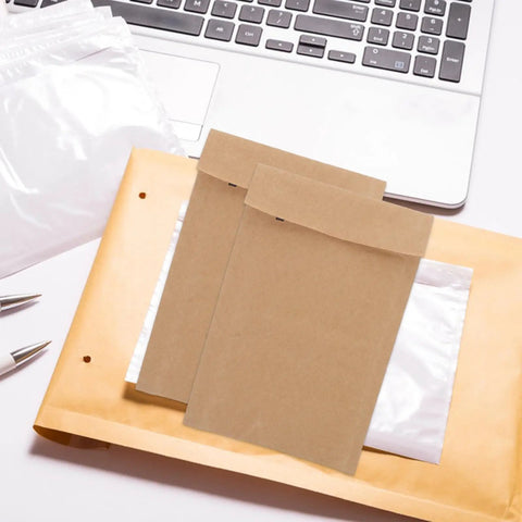 Kraft Paper Envelopes With Honeycomb Padding And Double Layer Design on a desk with a laptop, 50 Pack visible