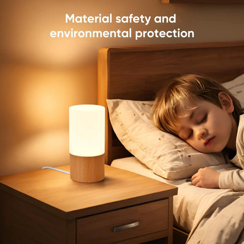 Cozy Beech Wood Table Lamp With Dimmable LED Light beside sleeping child on nightstand, emitting a soft glow for relaxing evenings.