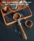 Premium 58mm Bottomless Portafilter With Thick Walnut Handle For Breville Dual Boiler And Oracle Touch Espresso Machines on a dark surface.