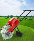 Manual Seeder Spreader With Eight Seed Plates in garden setting, hand push roller planter, red and black design.