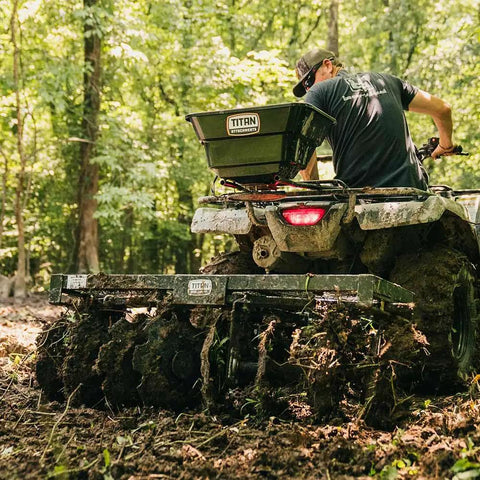 Tow Behind Notched Disc Harrow Attachment for ATV UTV 4 Ft Wide With 2 In Towball Hitch 14 In Concave Discs in forest field