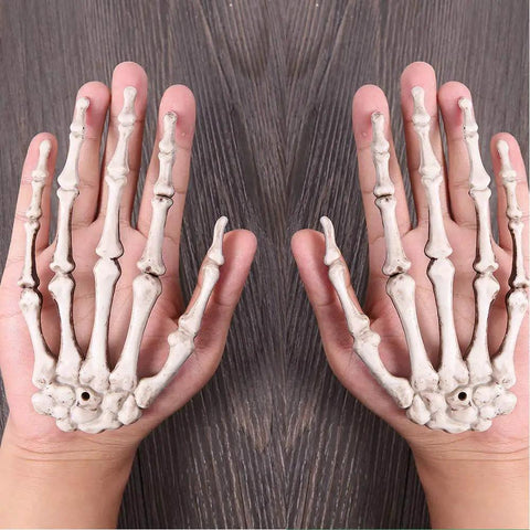 Person holding Six Pack Halloween Skeleton Hands Set Realistic Plastic Skeleton Hands for Spooky Decor Right and Left Hands