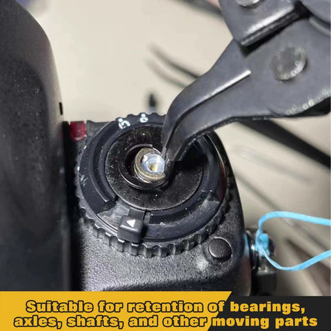 Close-up of pliers using All In One C-Clip And E-Clip Kit With 1036 Pieces on a mechanical part.