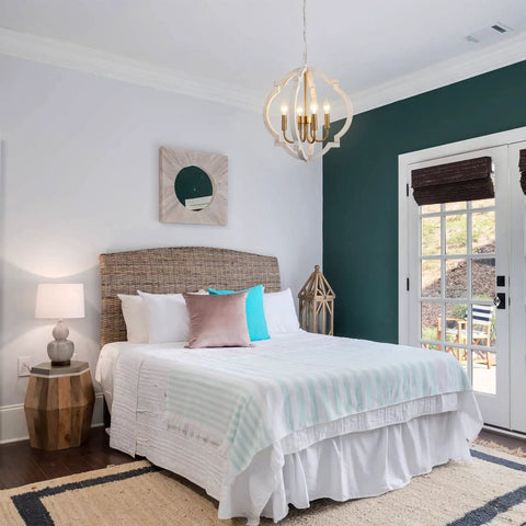 Modern Farmhouse 4 Light Wood Chandelier In Distressed White And Gold With Orb Globe Cage Pendant Lighting For Dining Room Kitchen Island And Foyer For Any Space over a bright bedroom with teal accents
