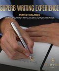 Person writing with Luxurious Silver Chrome Ballpoint Pen With Real Gold Plating And Schmidt Black Refill on a notepad.