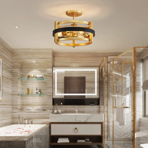 Modern bathroom interior with gold circular ceiling light fixture over a marble bathtub and vanity area.