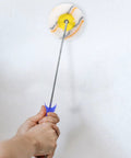 Slick Paint Roller Brush And Corner Edger For Snug Corners Window Trim And Door Frames used for painting a wall.