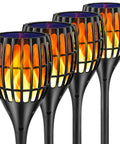 Four Solar Torch Lights Outdoor 43 Inch Flickering Flame Garden Lights Waterproof Landscape Lighting in a row