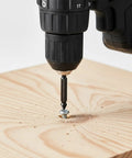 Close-up of drill using Six Piece Damaged Screw Extractor Set For Easy Out Bolts, Stripped Screw Remover Tool, And Stud Removal on wood