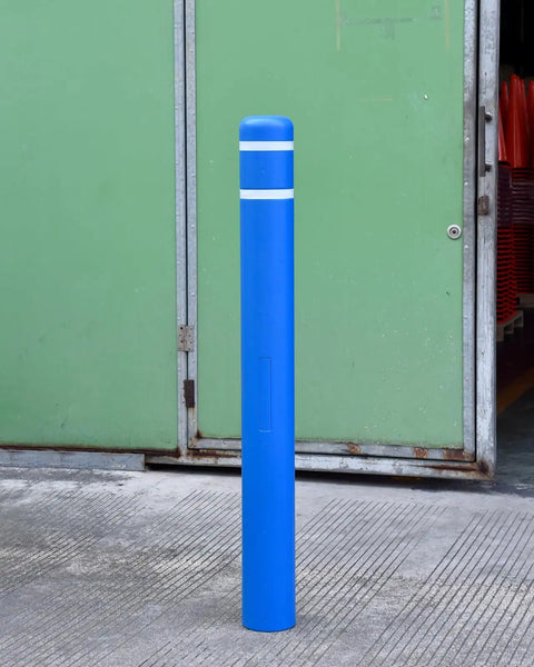 Tough As Nails Blue Safety Bollard Cover 6 Inch Wide 46 Inch Tall with reflective tape in a parking lot setting.